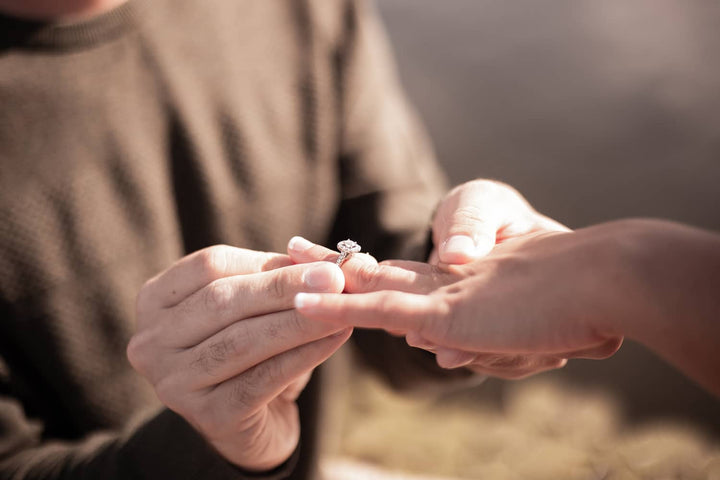 Man proposing to woman with engagement ring - Photo Credit: Andre Jackson/Unsplash